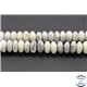 Perles semi précieuses en howlite - Roues/8 mm