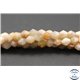 Perles semi précieuses en pierre de soleil - Toupies/6 mm - Rose saumon
